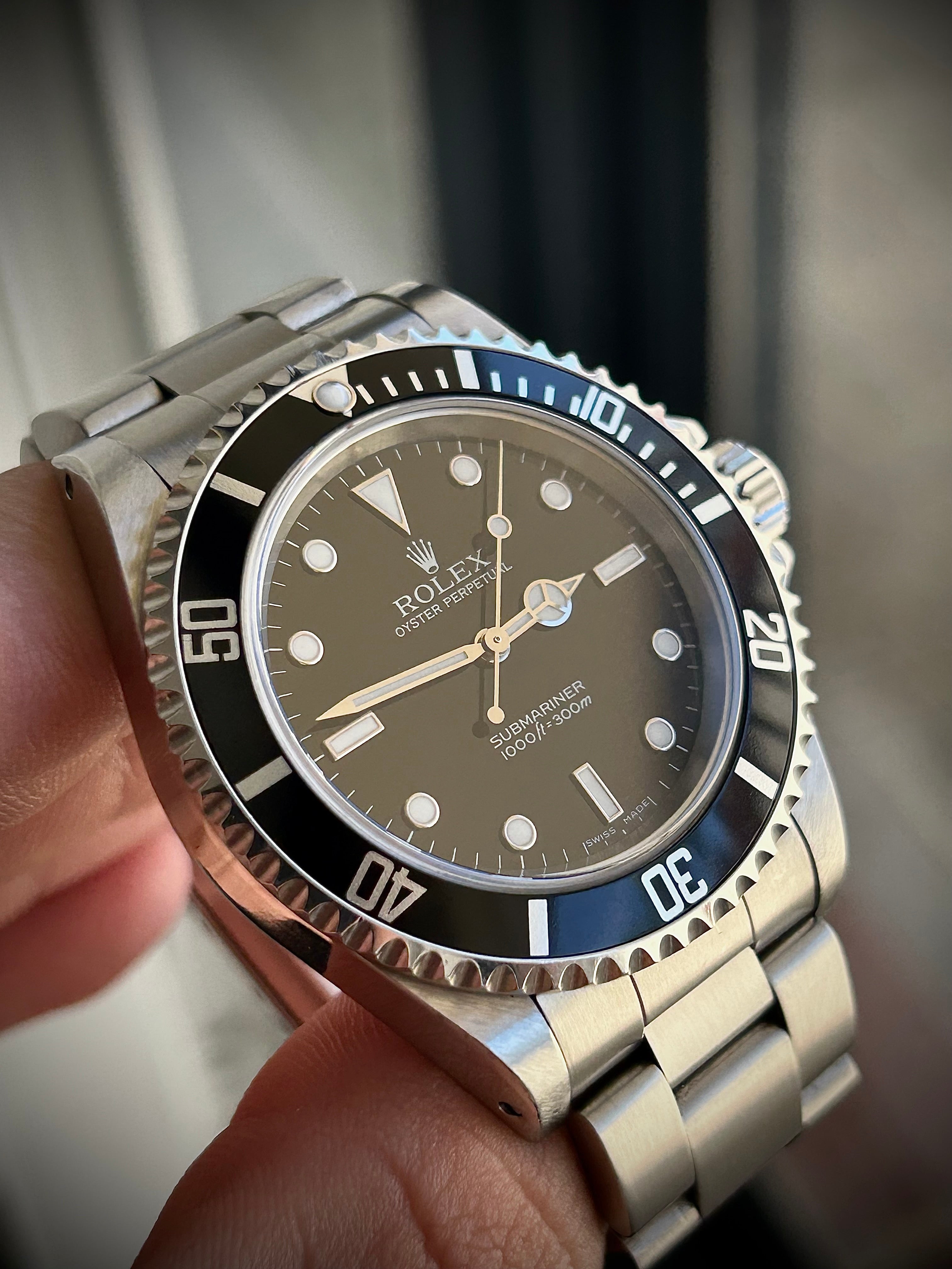 2006 ROLEX SUBMARINER TWO-LINER 14060M, WATCH AND PAPERS, INC GST