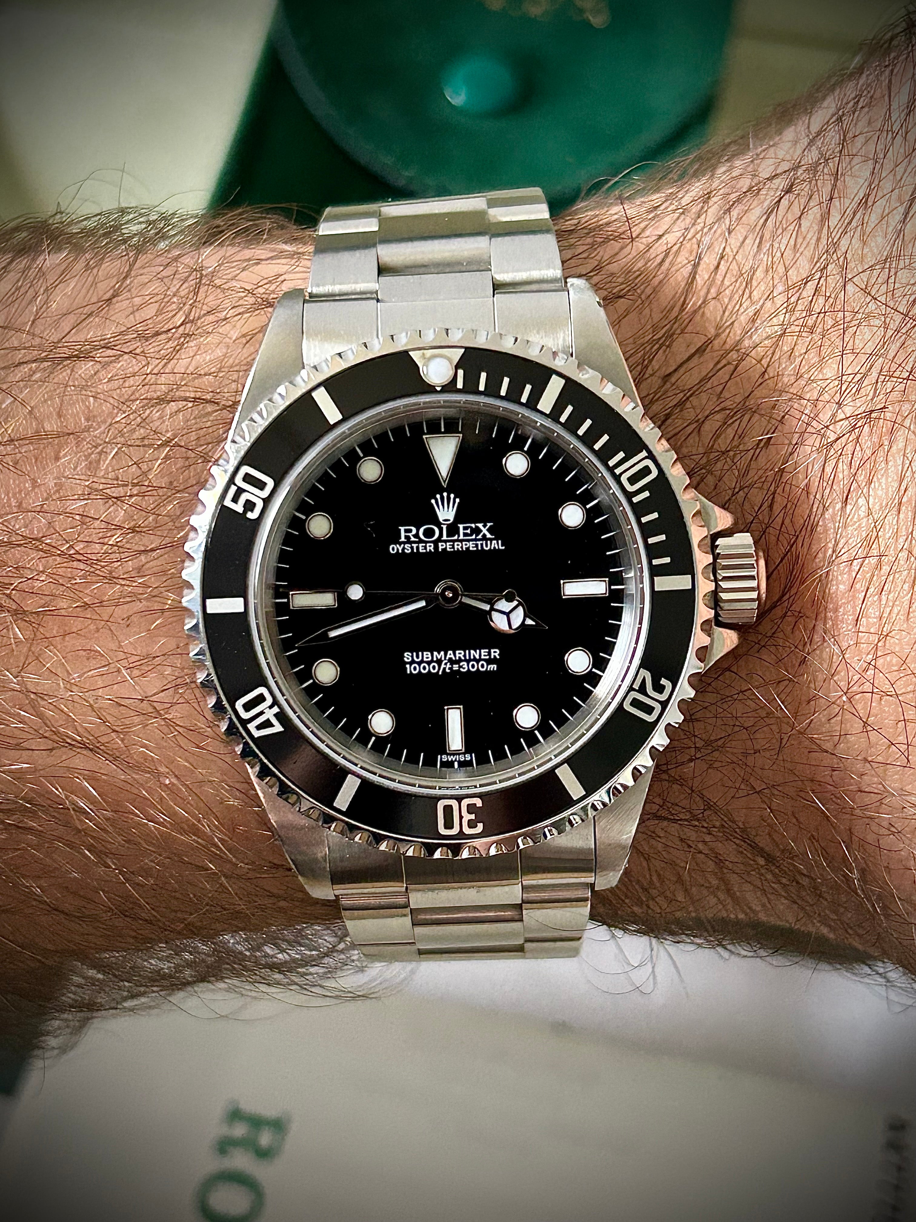 1999 ROLEX SUBMARINER NO-DATE, TWO LINER, SWISS ONLY, 14060, BOX AND PAPERS WITH RSC, INC GST