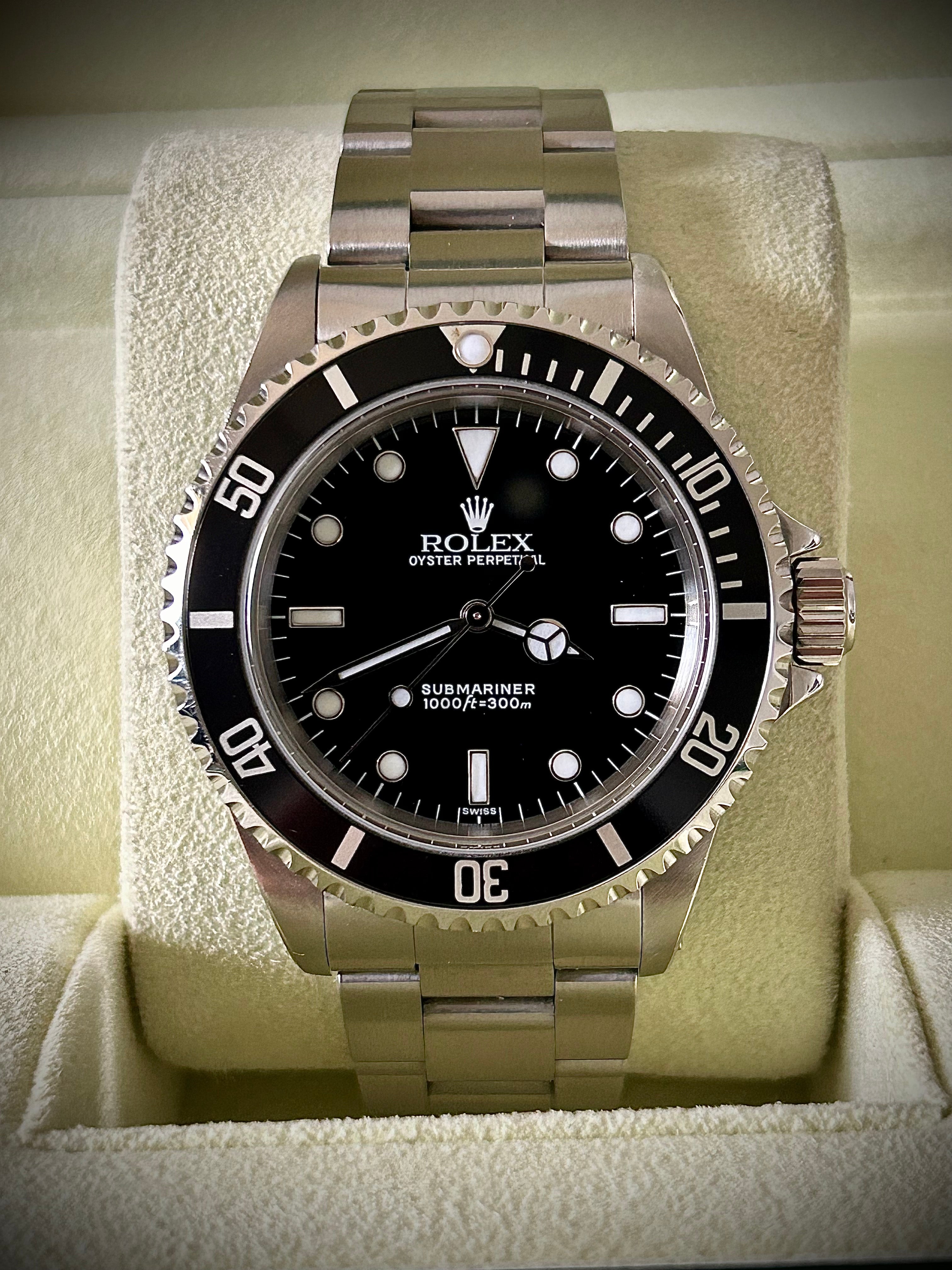 1999 ROLEX SUBMARINER NO-DATE, TWO LINER, SWISS ONLY, 14060, BOX AND PAPERS WITH RSC, INC GST