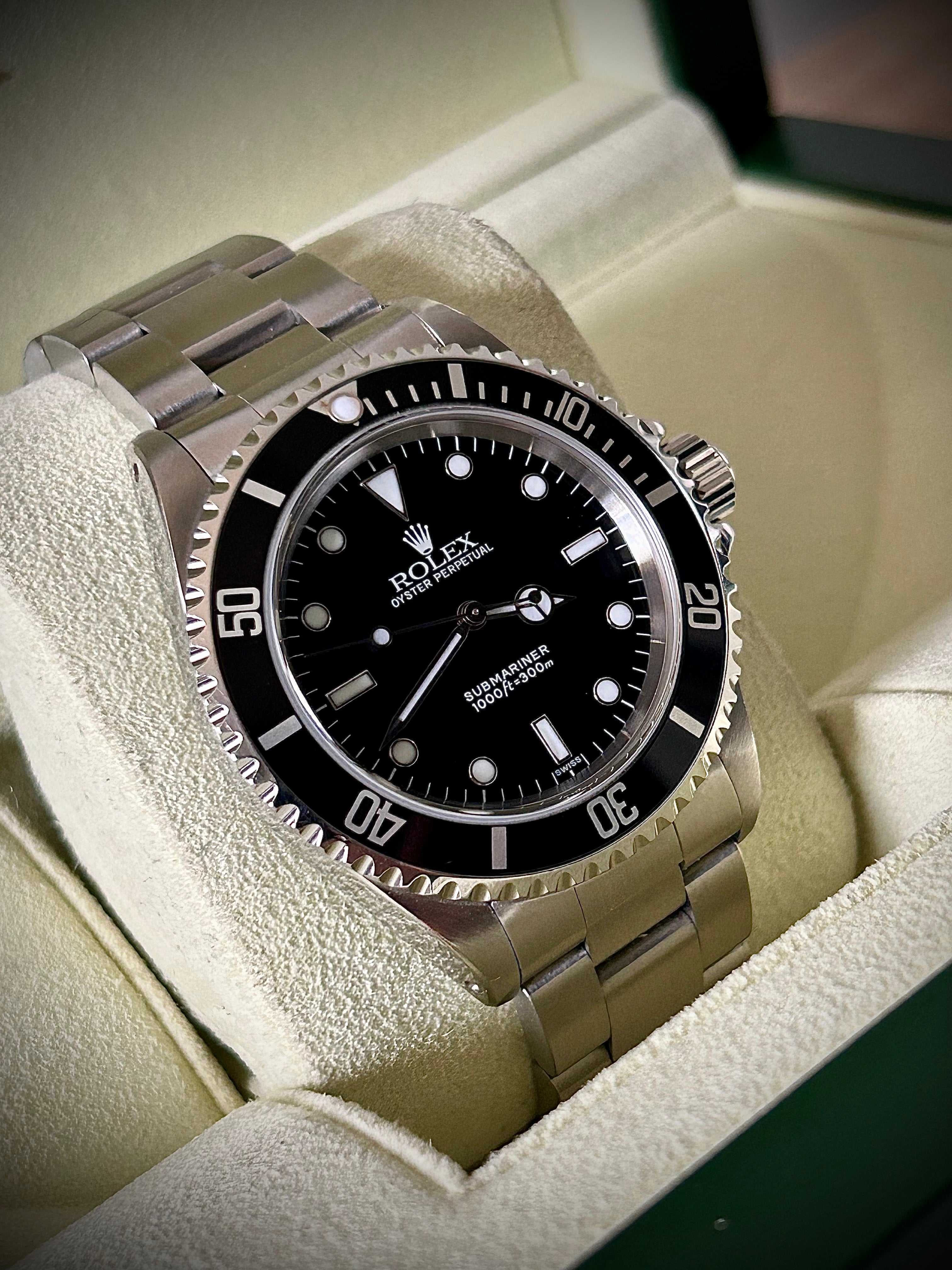 1999 ROLEX SUBMARINER NO-DATE, TWO LINER, SWISS ONLY, 14060, BOX AND PAPERS WITH RSC, INC GST