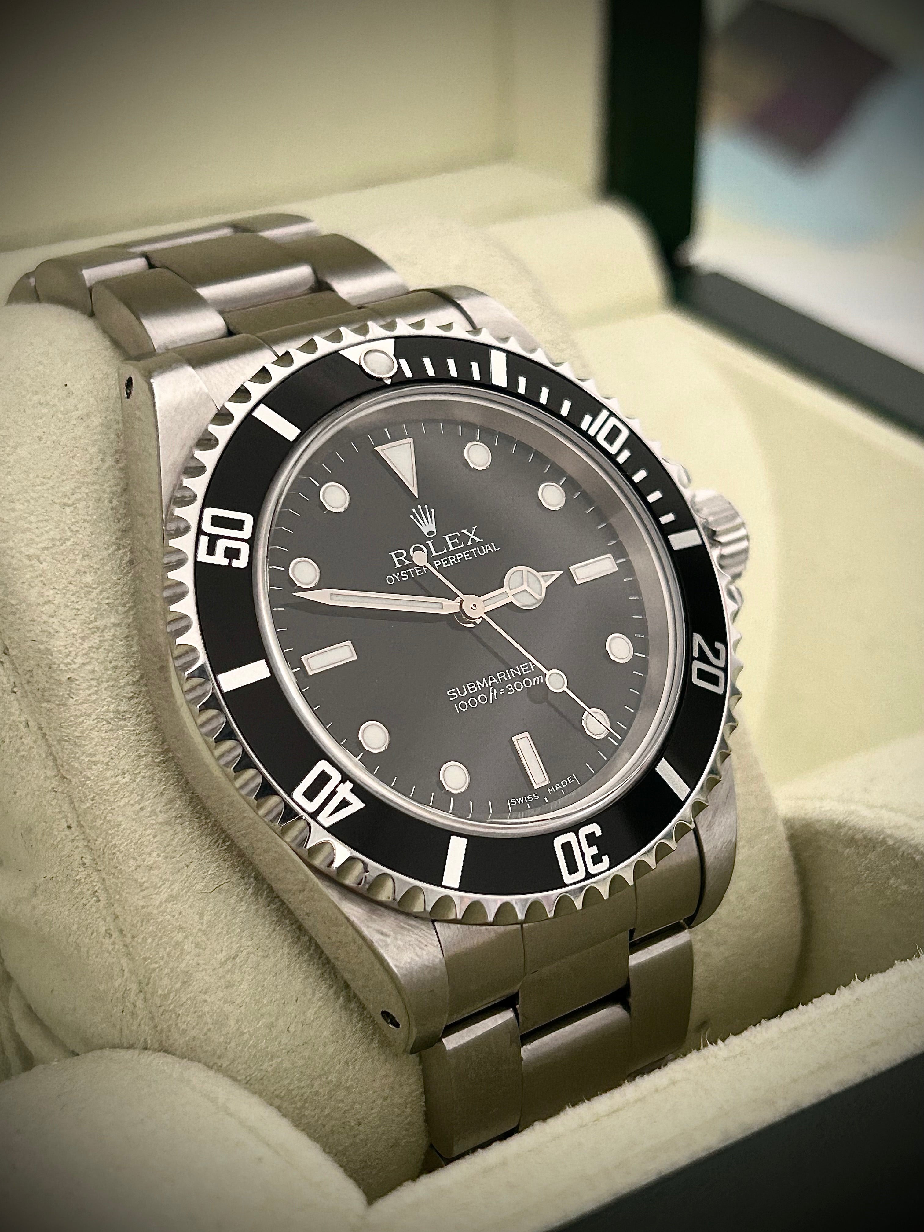 2006 ROLEX SUBMARINER TWO-LINER 14060M, WATCH AND PAPERS, INC GST