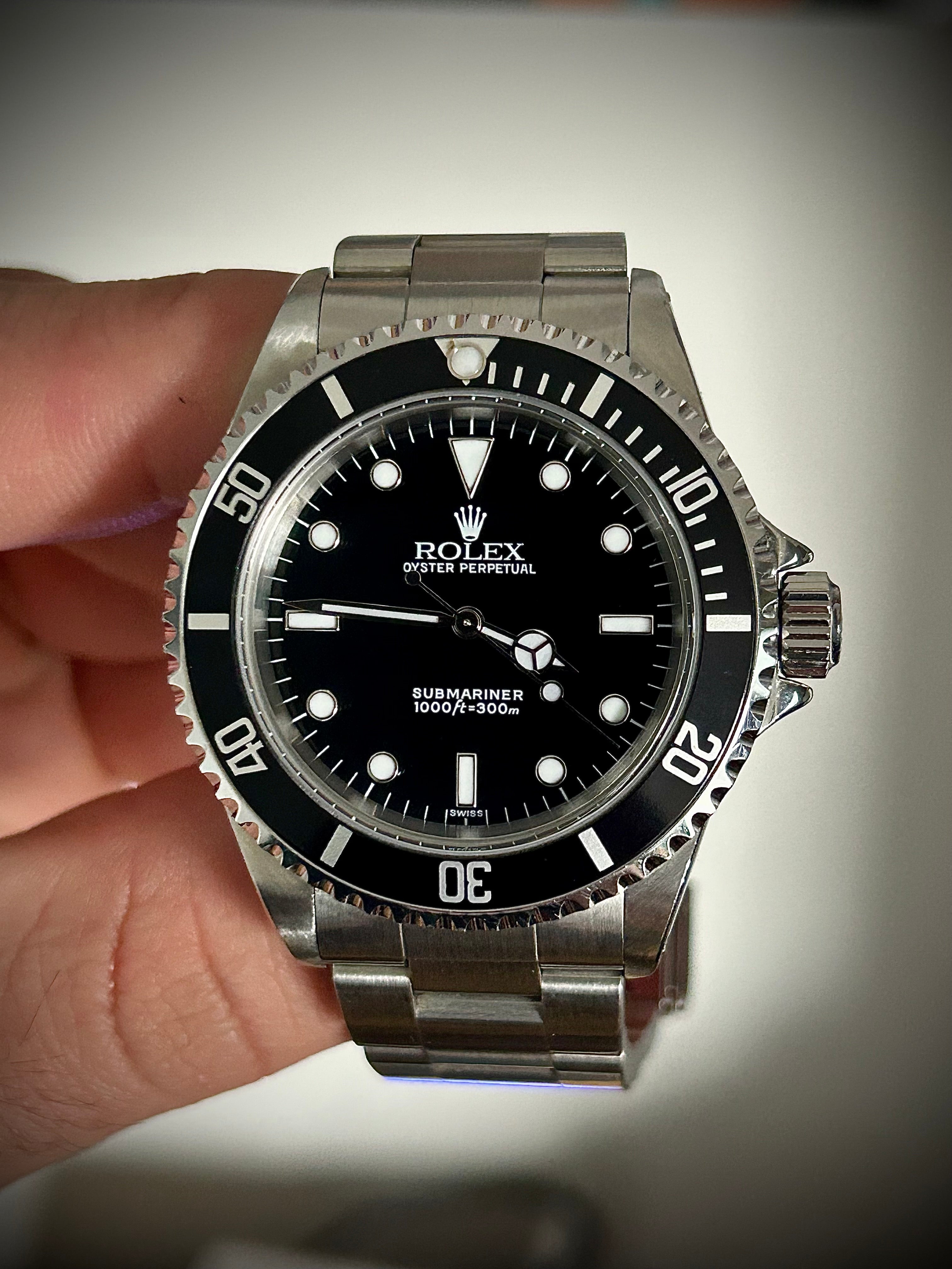 1999 ROLEX SUBMARINER NO-DATE, TWO LINER, SWISS ONLY, 14060, BOX AND PAPERS WITH RSC, INC GST