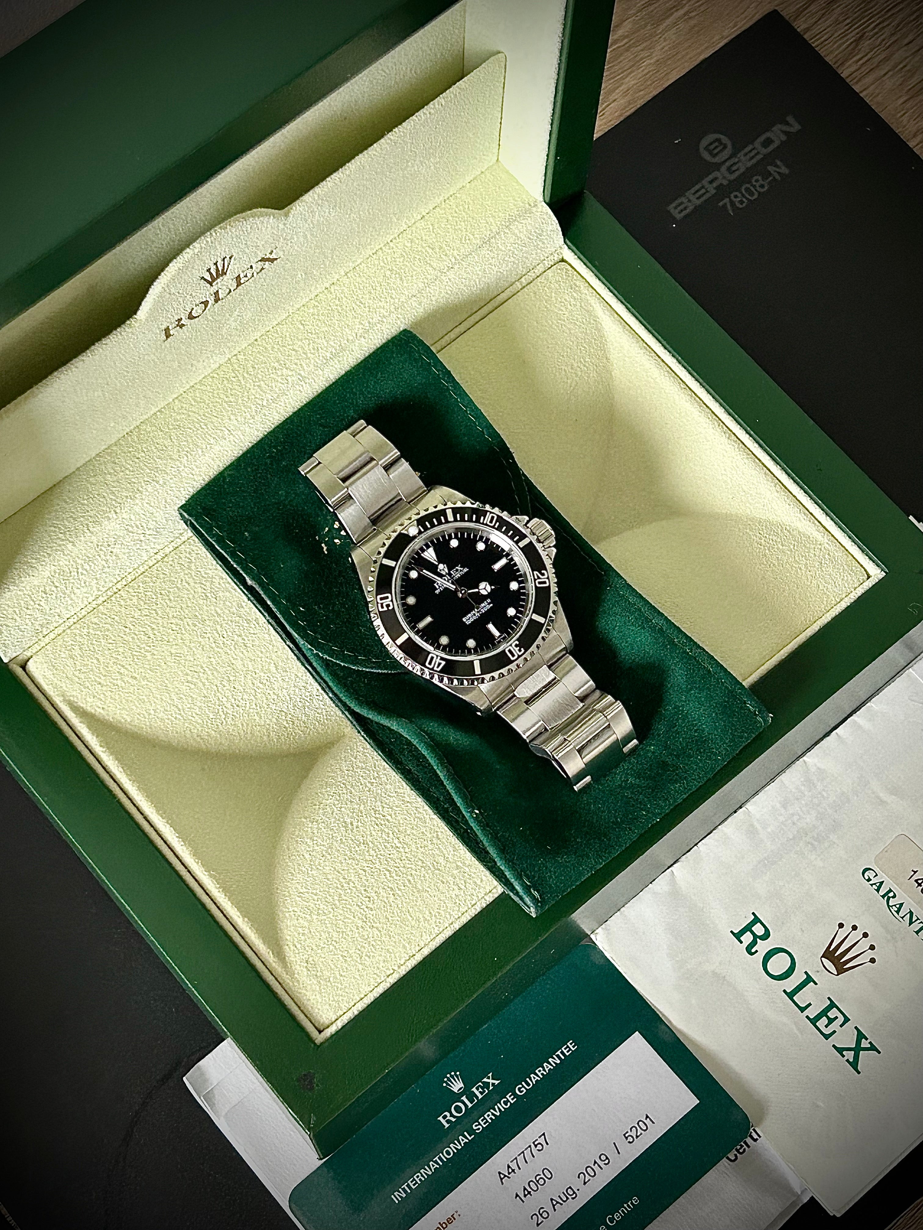 1999 ROLEX SUBMARINER NO-DATE, TWO LINER, SWISS ONLY, 14060, BOX AND PAPERS WITH RSC, INC GST
