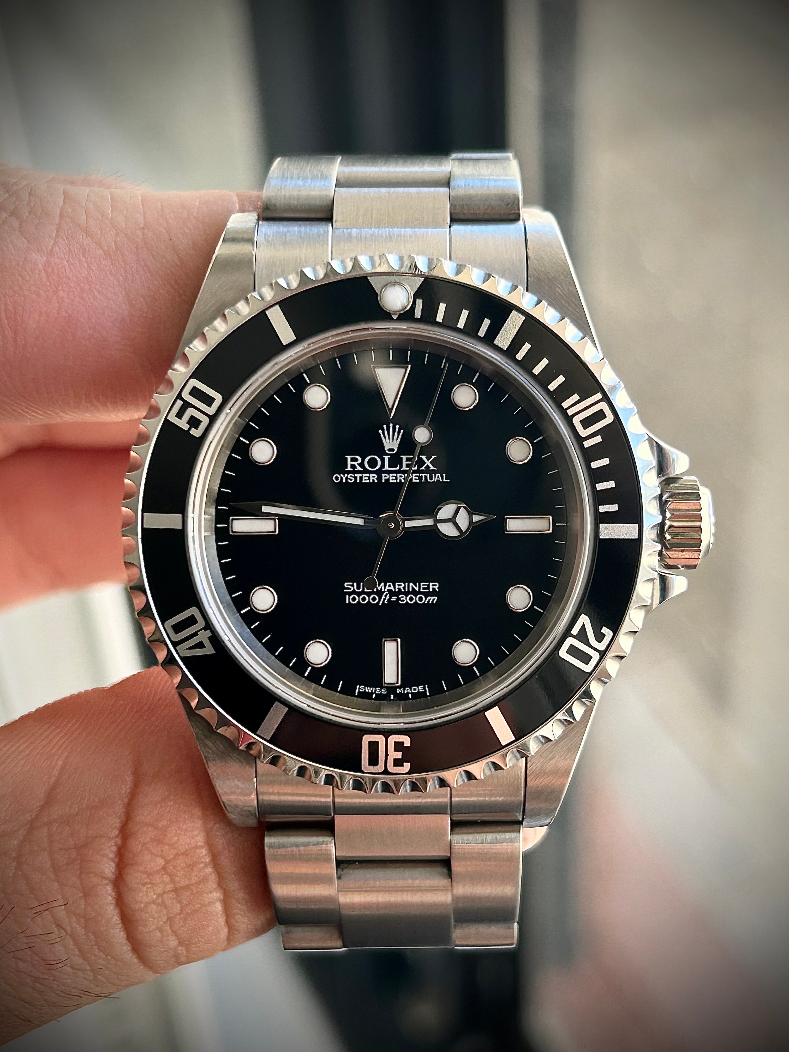 2006 ROLEX SUBMARINER TWO-LINER 14060M, WATCH AND PAPERS, INC GST