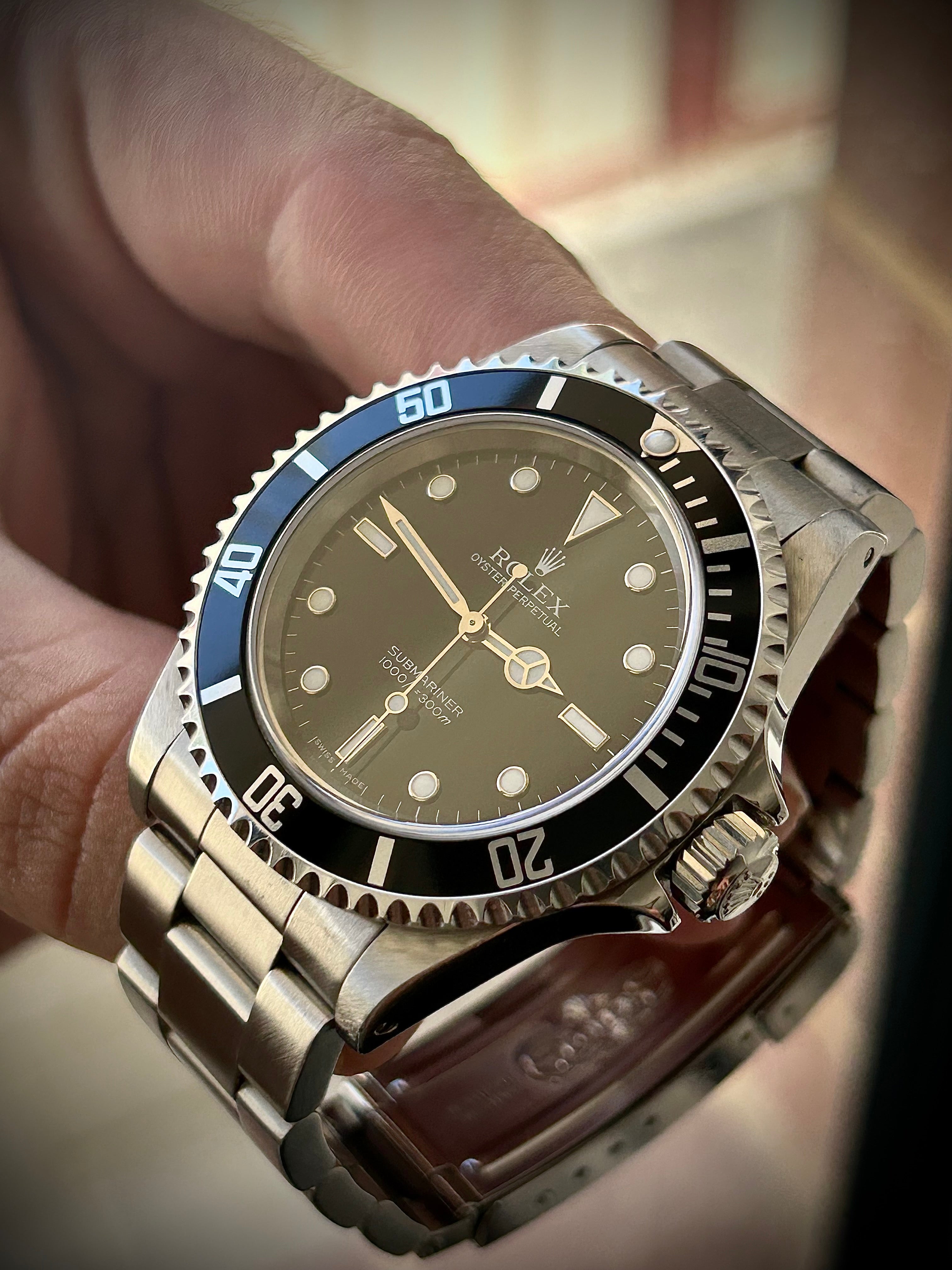 2006 ROLEX SUBMARINER TWO-LINER 14060M, WATCH AND PAPERS, INC GST