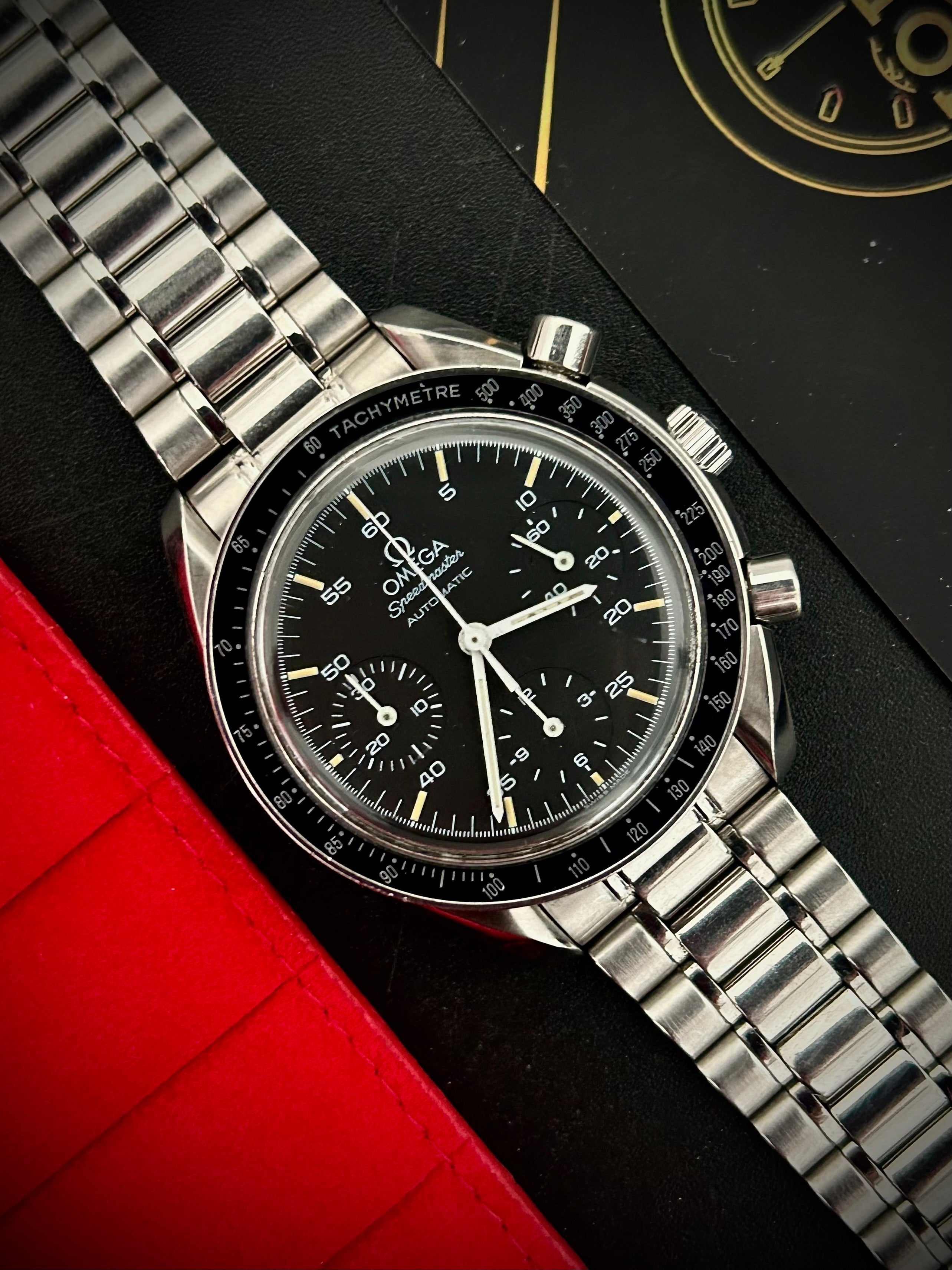 1996 OMEGA SPEEDMASTER REDUCED, WITH BOX, INC GST