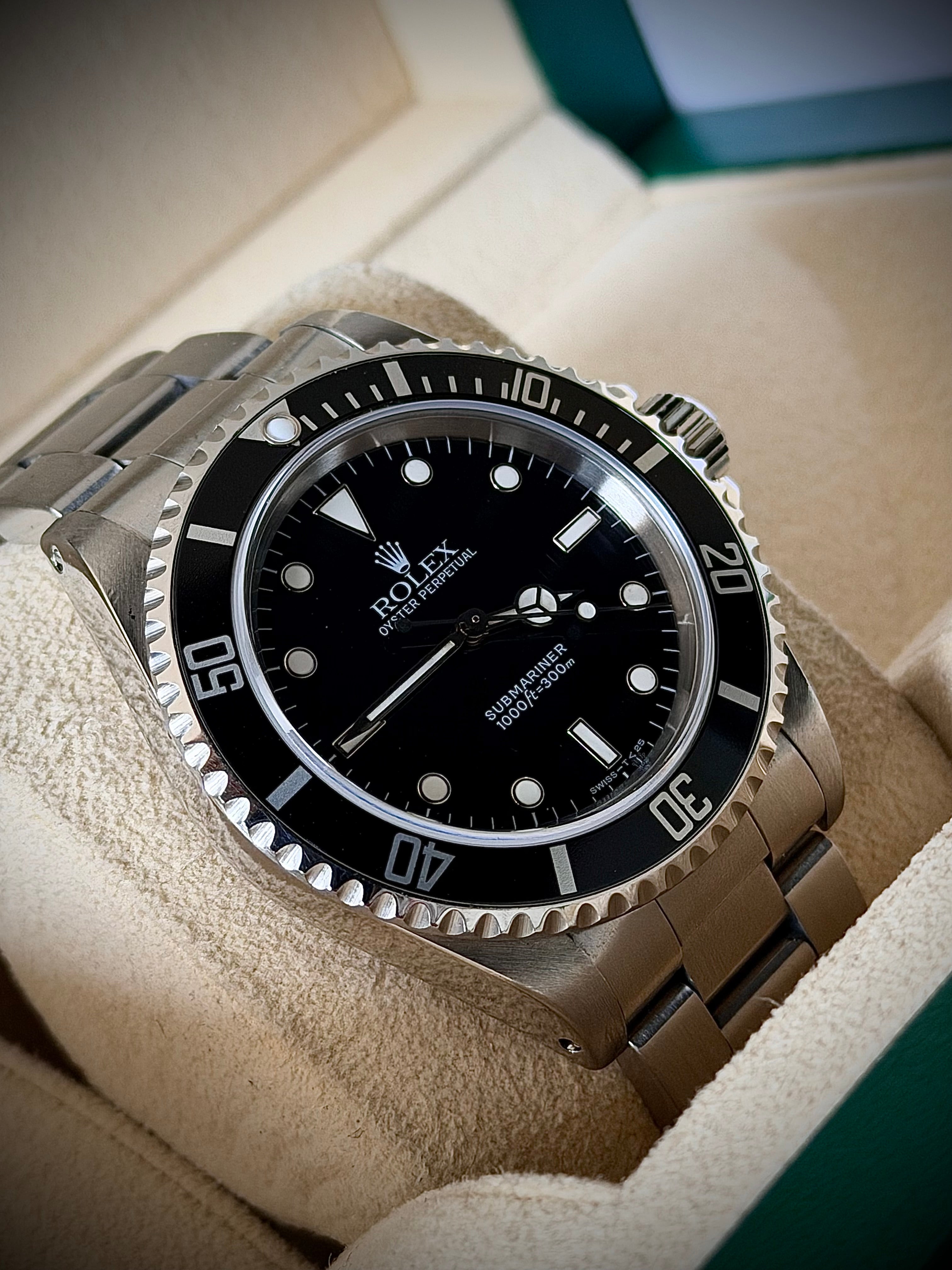 1997 ROLEX SUBMARINER NO-DATE, TWO LINER, 14060, BOX AND PAPERS, INC GST