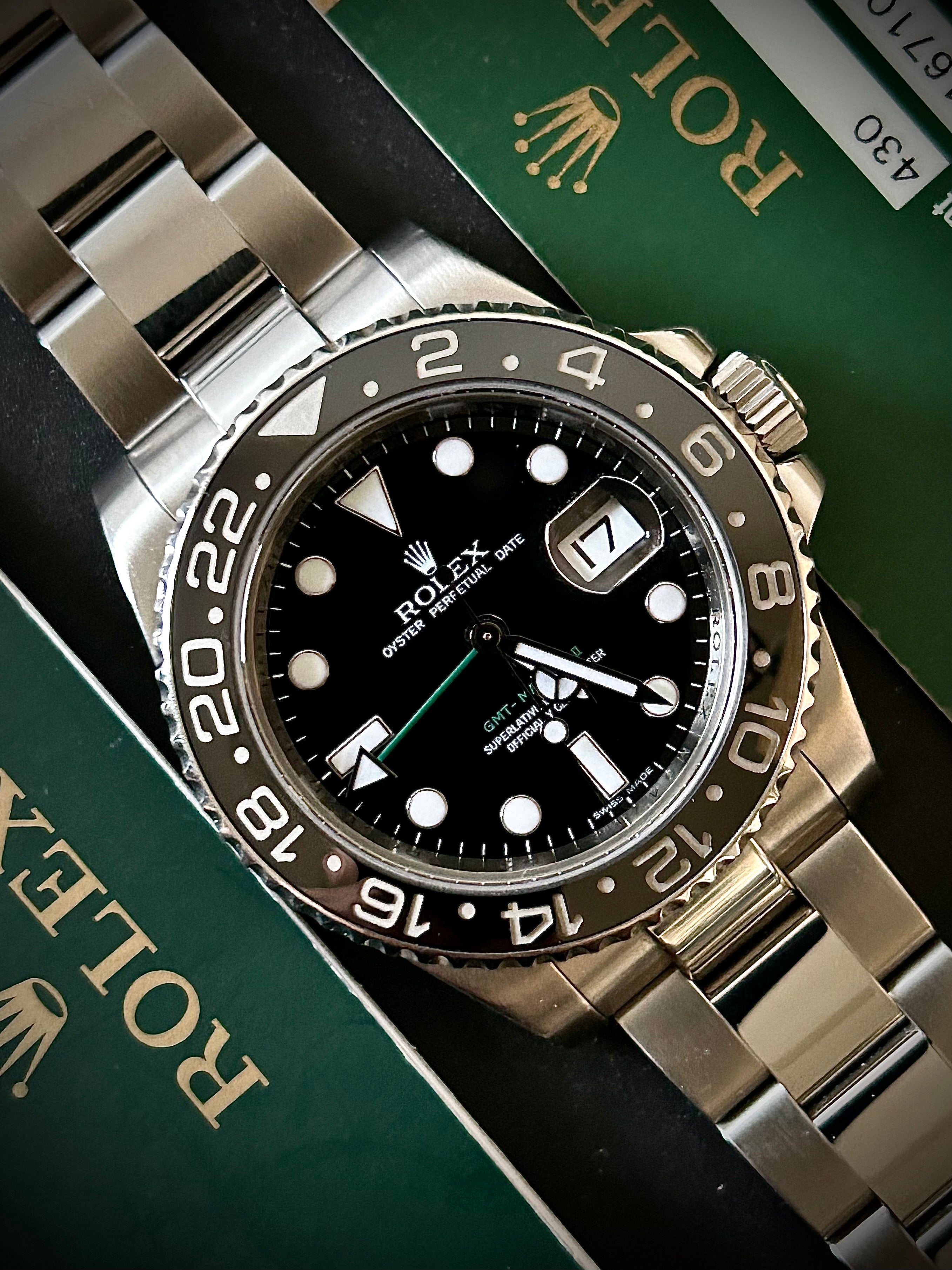 2007 ROLEX GMT MASTER II, 116710LN, BOX AND PAPERS, INC GST