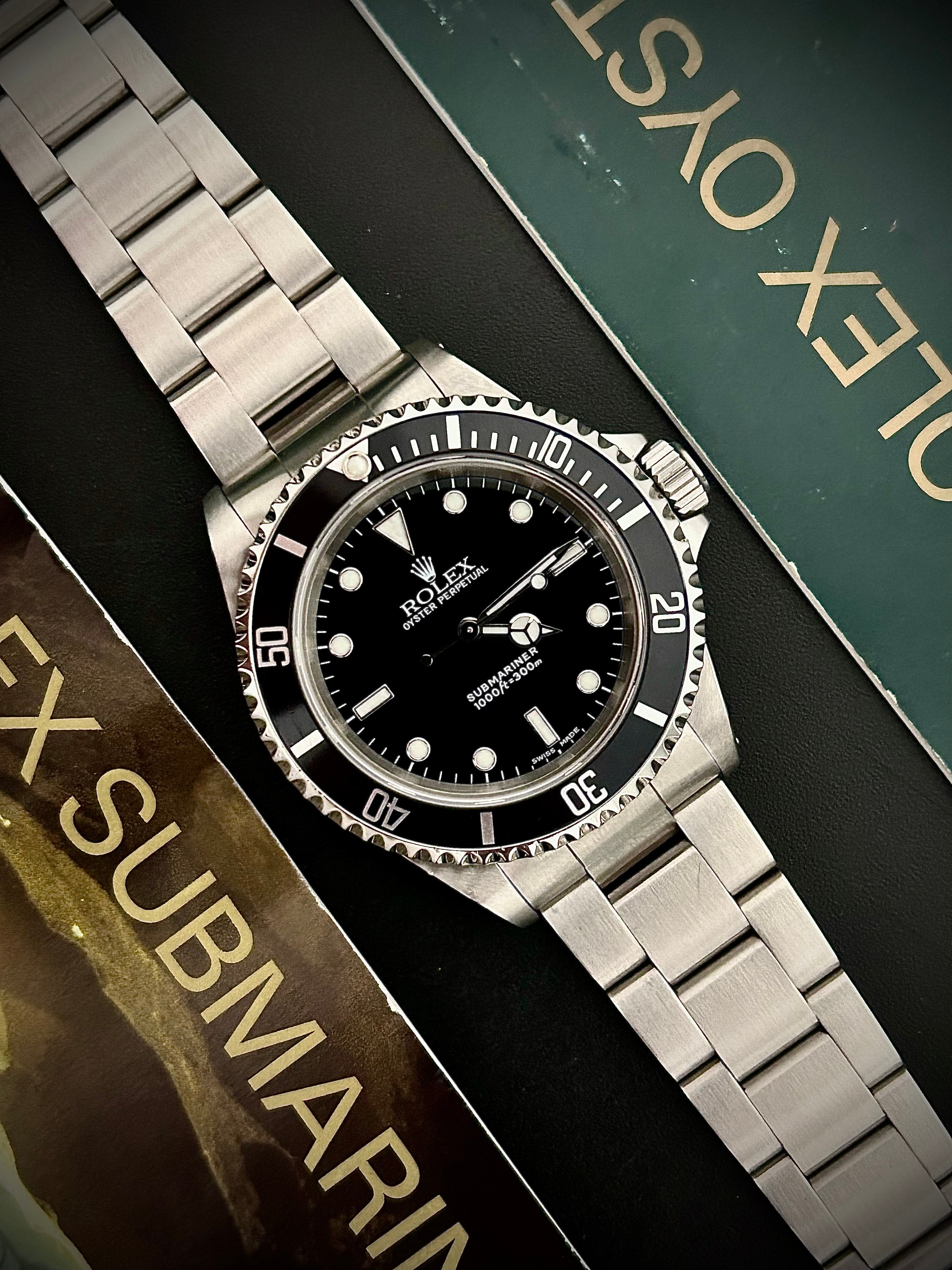 2001 ROLEX SUBMARINER TWO-LINER 14060M, RSC SERVICE, INC GST