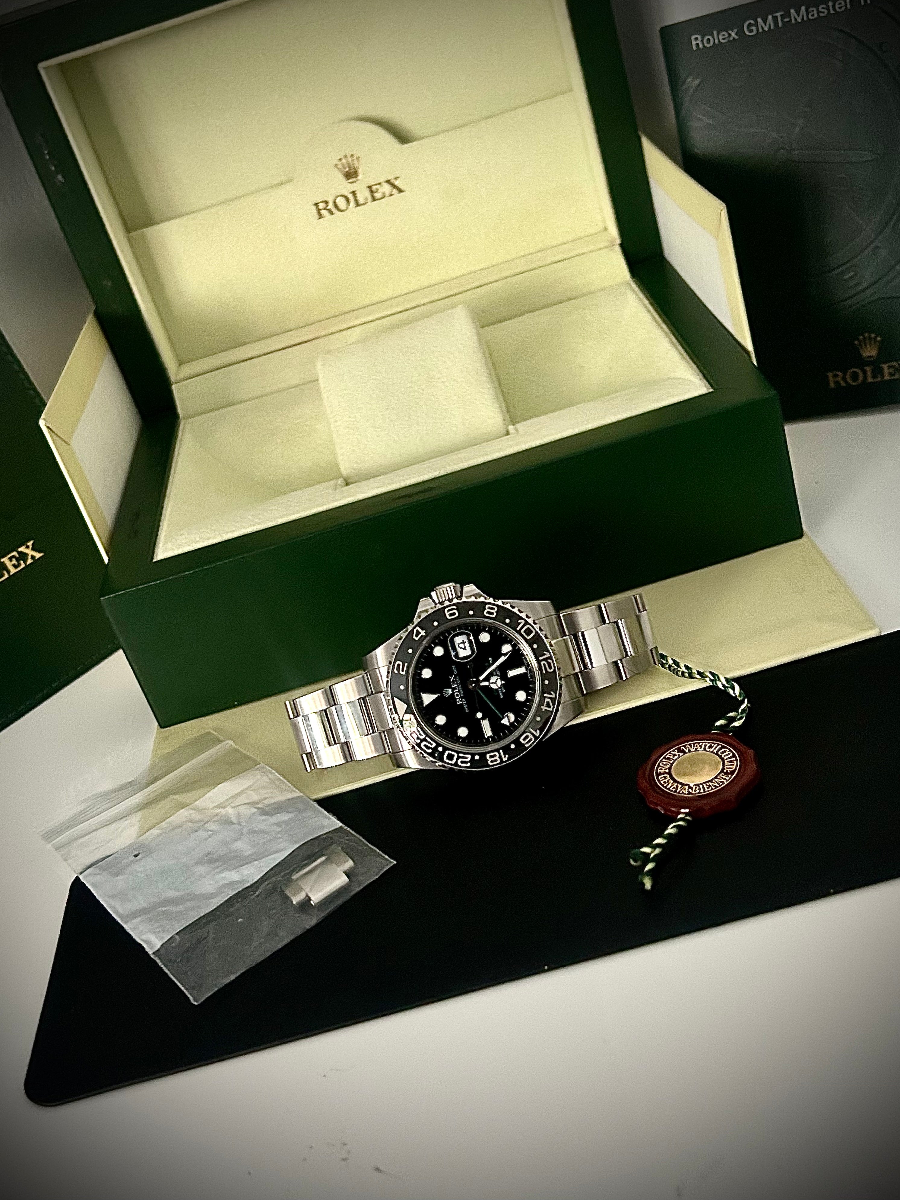 2009 ROLEX GMT MASTER II, BOX AND BOOKLETS, 116710LN, INC GST