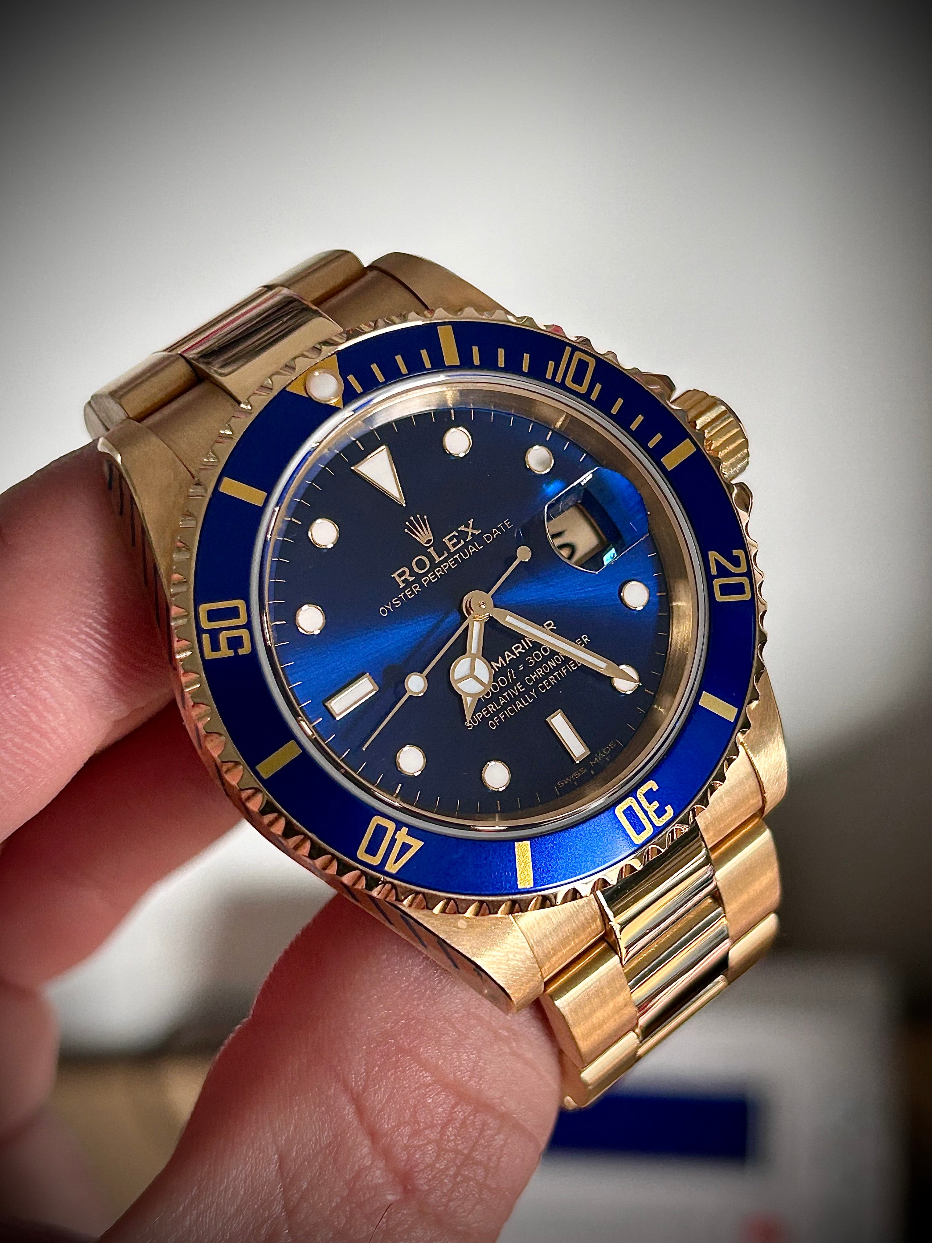 1991 ROLEX SUBMARINER DATE “BLUESY”, FULL GOLD, 16618LB, BOX AND RSC, INC GST