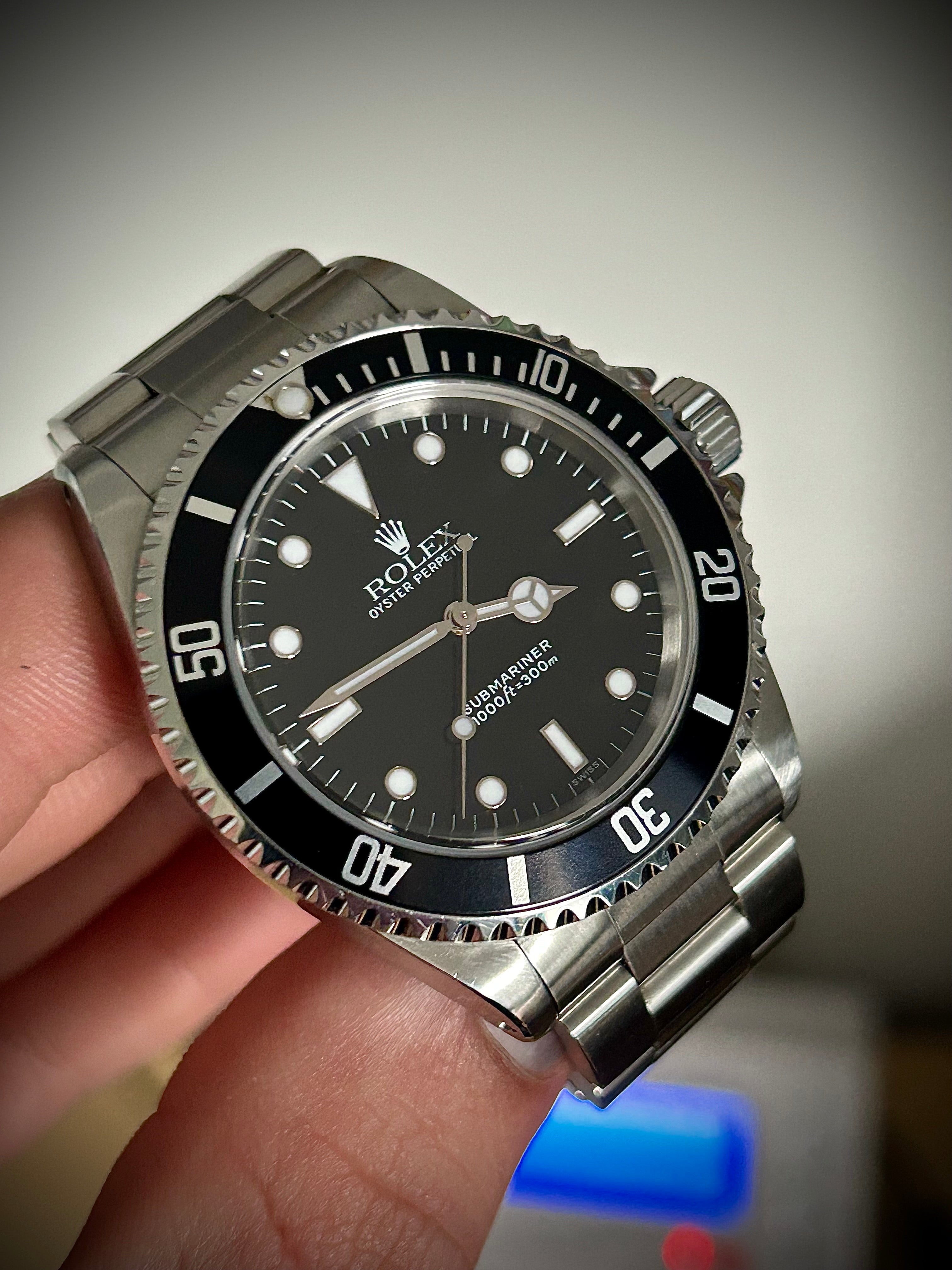 1999 ROLEX SUBMARINER NO-DATE, TWO LINER, SWISS ONLY, 14060, BOX AND PAPERS WITH RSC, INC GST