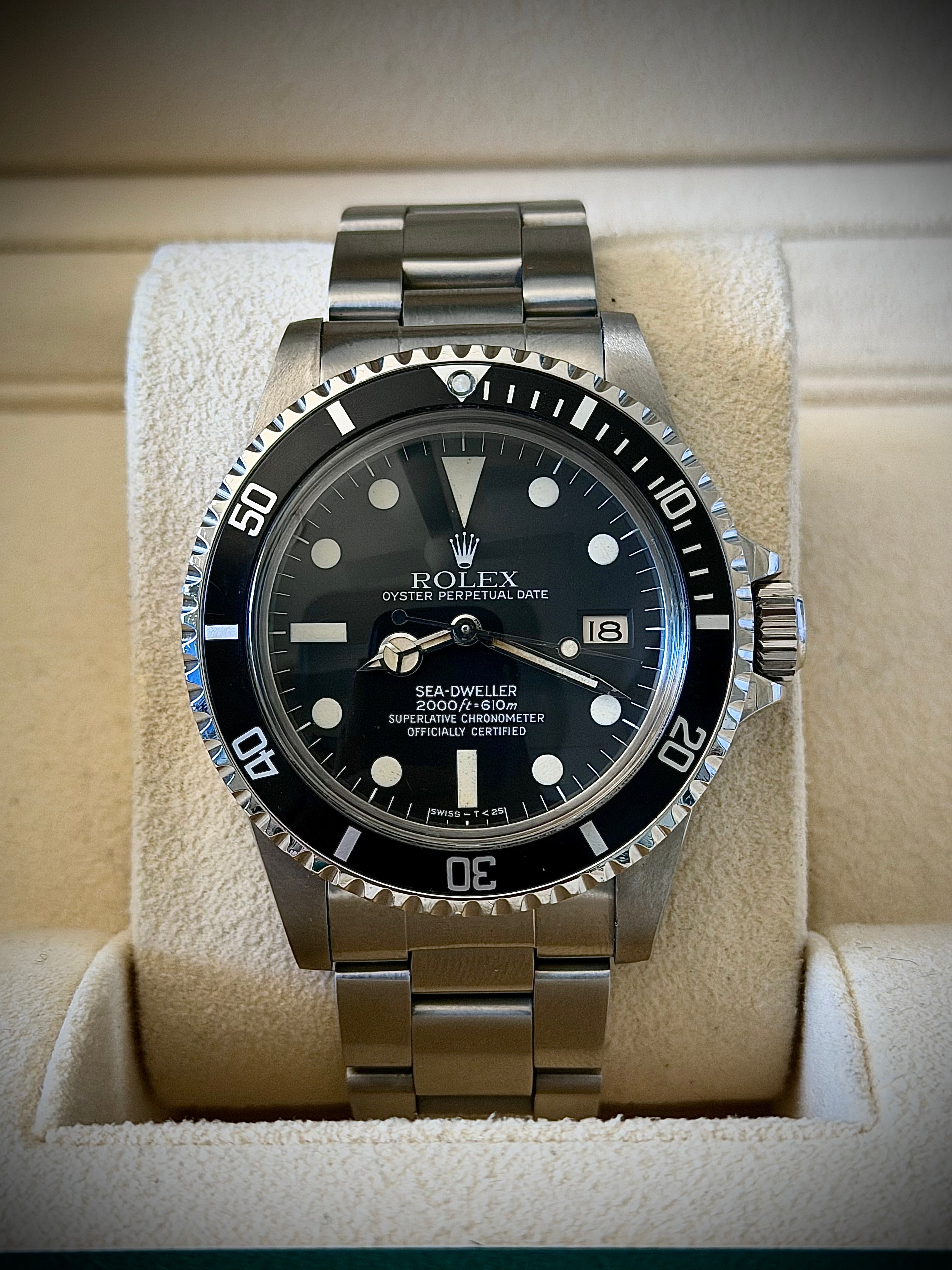 1981 ROLEX SEA-DWELLER 1665 “GREAT WHITE”, BOX AND PAPERS, INC GST