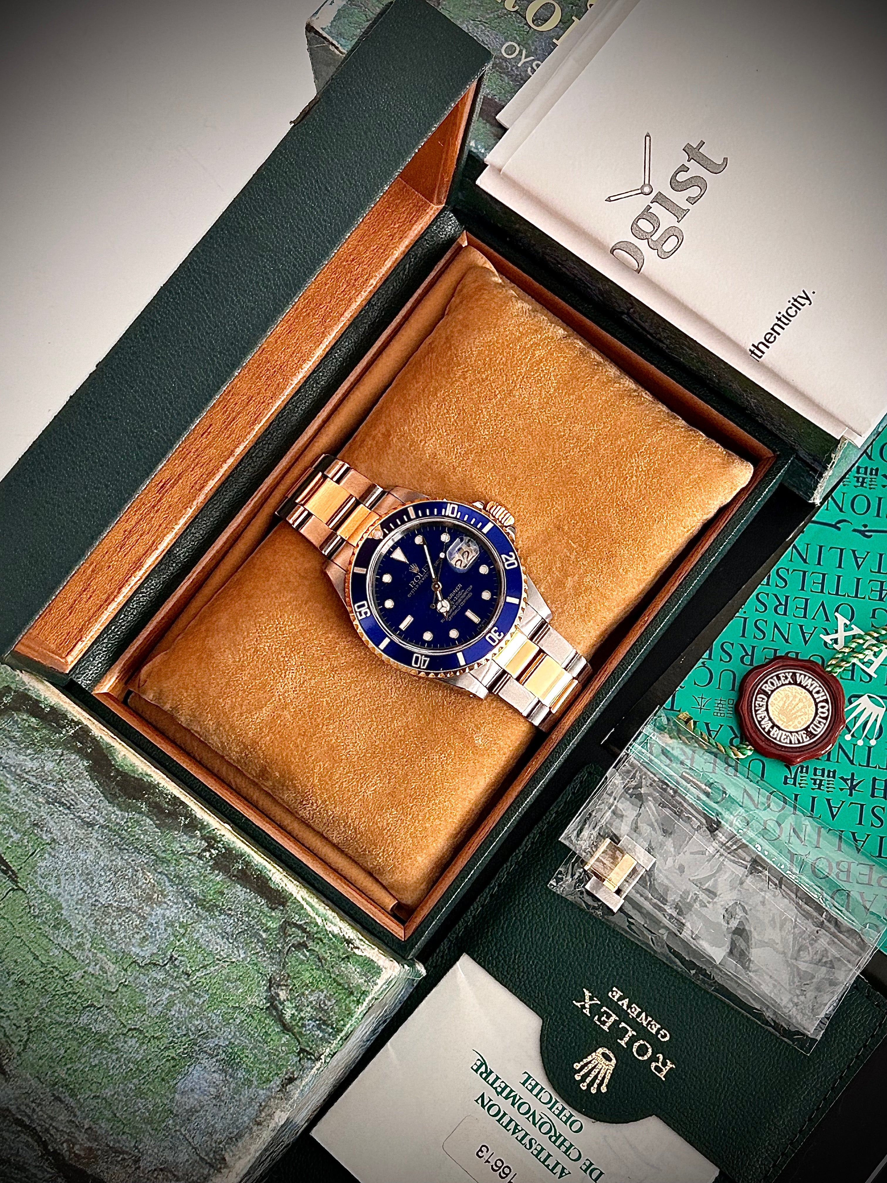 1999 ROLEX SUBMARINER DATE “BLUESY”, SWISS ONLY, FULL SET, INC GST