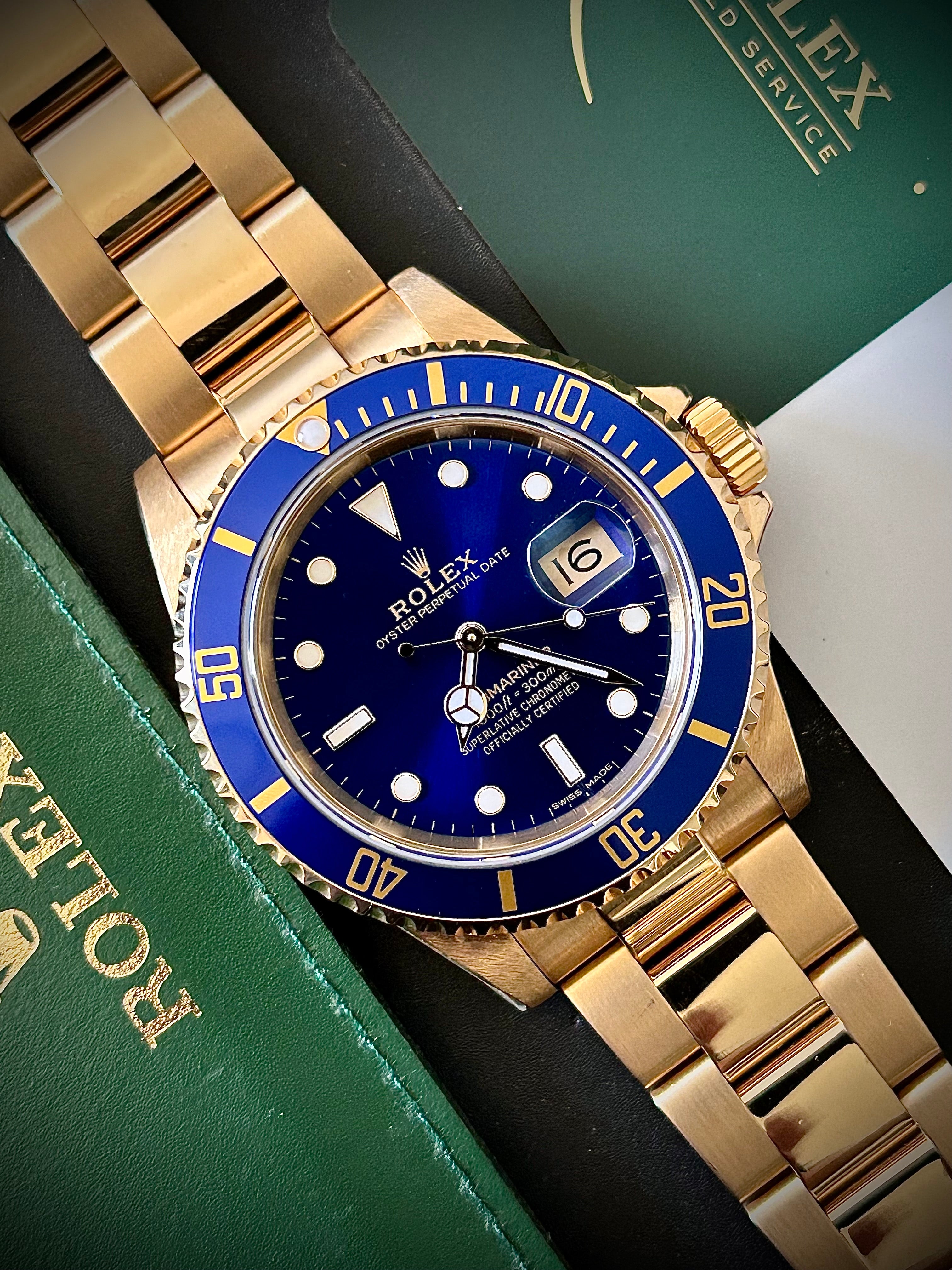 1991 ROLEX SUBMARINER DATE “BLUESY”, FULL GOLD, 16618LB, BOX AND RSC, INC GST