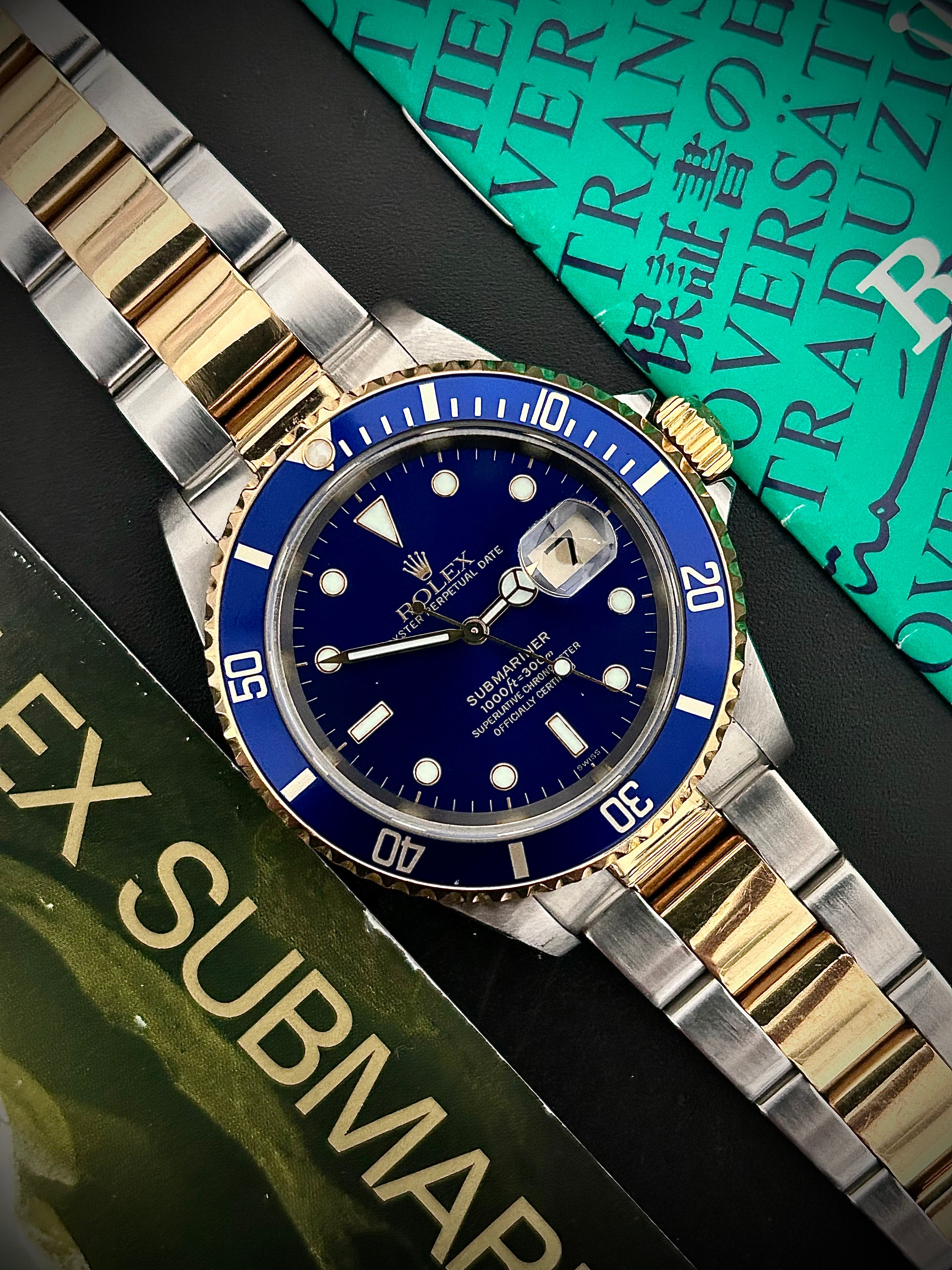 1999 ROLEX SUBMARINER DATE “BLUESY”, SWISS ONLY, FULL SET, INC GST