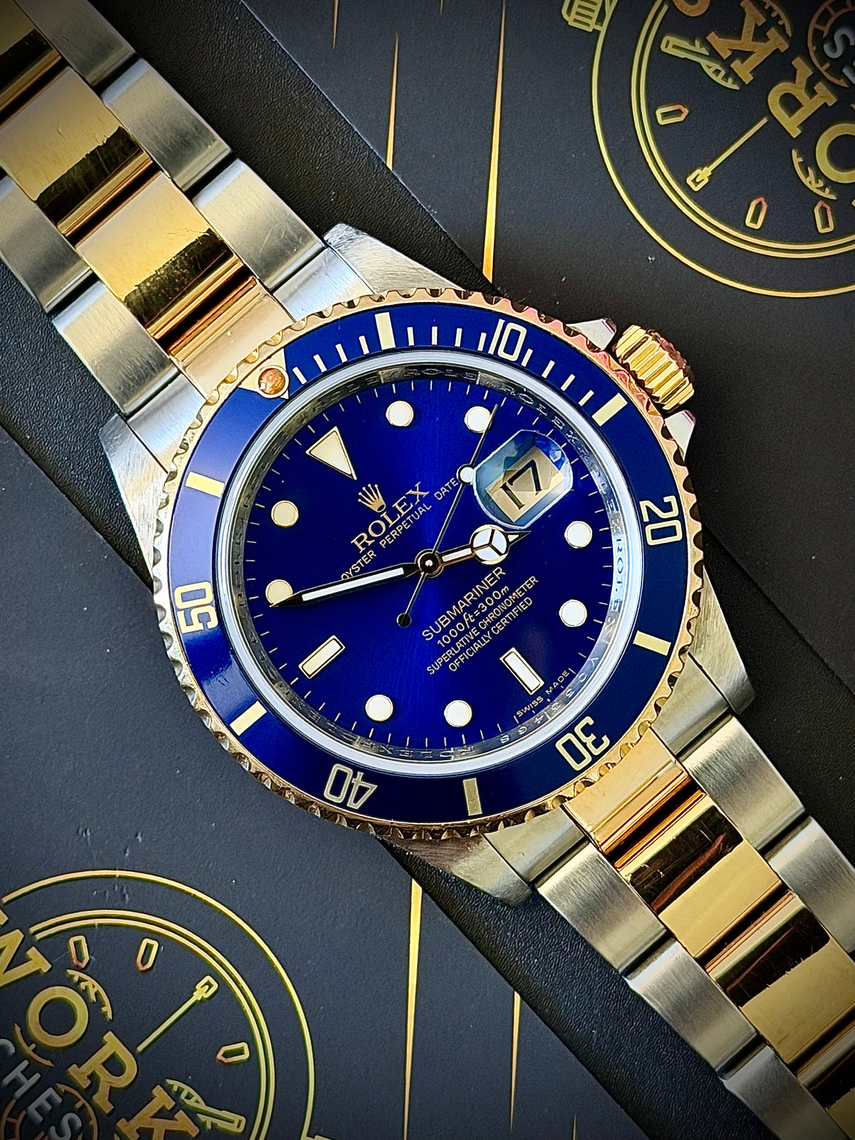 2009 ROLEX SUBMARINER DATE “BLUESY”, 16613LB, ENGRAVED REHAUT, NO HOLES CASE, SOLID END LINKS, WATCH ONLY, INC GST