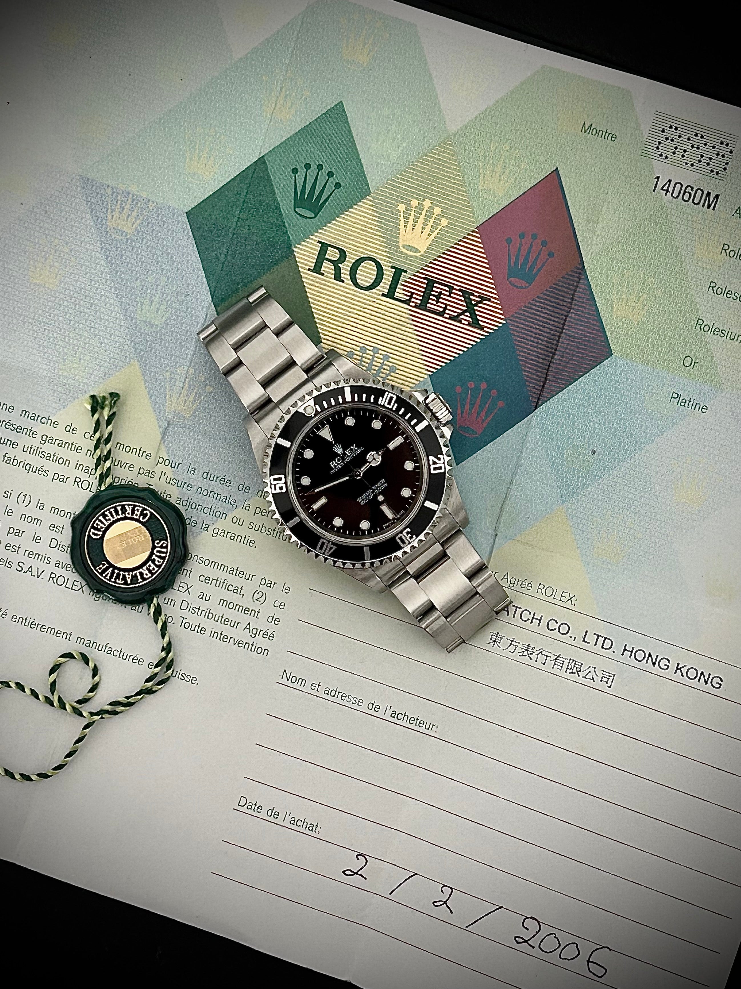 2006 ROLEX SUBMARINER TWO-LINER 14060M, WATCH AND PAPERS, INC GST
